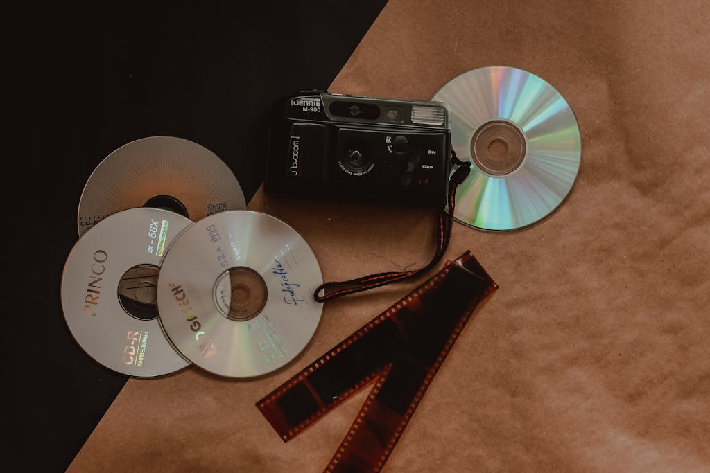 Discs Beside an Analog Camera